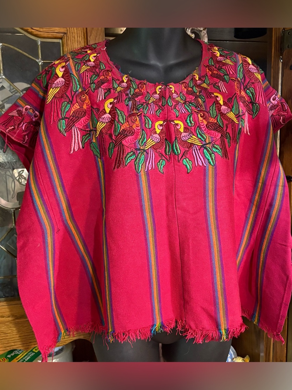 vintage Guatemalan huipil top featuring vibrant bird embroidery and red striped